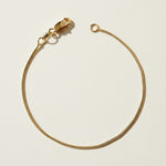 round snake chain bracelet, gold snake chain bracelet, smooth round chain bracelet, 18k gold overlay bracelet, flexible gold bracelet, minimalist snake chain, delicate round chain bracelet, gold chain clasp detail