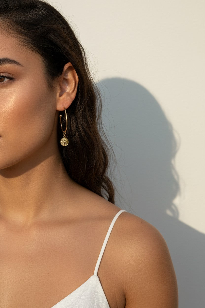 gold coin charm earrings, coin hoop earrings, gold hoop earrings with charm, vintage coin jewelry, dangle hoop earrings, everyday gold earrings, medallion earrings, on-model earring photography