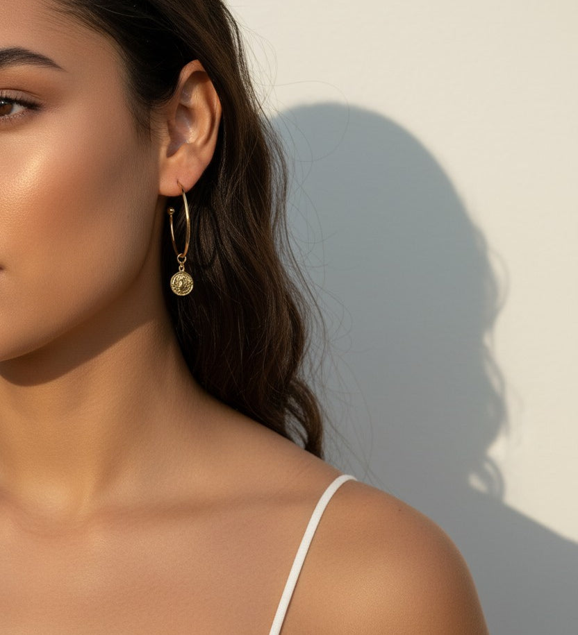 gold coin charm earrings, coin hoop earrings, gold hoop earrings with charm, vintage coin jewelry, dangle hoop earrings, everyday gold earrings, medallion earrings, on-model earring photography