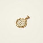 This gold pendant charm features a round medallion engraved with a cherub archer drawing a bow and arrow rendered in fine relief detail against a softly textured background. A decorative diamond-cut rope border frames the coin's edge, adding dimensional sparkle and an antique, collectible-coin character. The pendant hangs from a sturdy bail, ready to be added to a chain of your choice