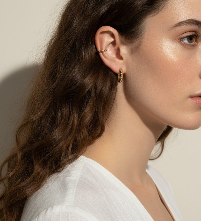 gold pyramid hoops on model, layered ear stack, textured huggie hoop earrings, simple gold ear cuff, gold hoop and cuff set, ear stacking gold jewelry, minimalist ear cuff pairing, edgy gold hoops worn
