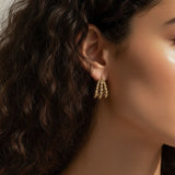 gold beaded hoop earrings on model, cluster hoop earrings worn, textured gold hoops styled, tiered gold earrings on ear, statement beaded earrings lifestyle, chunky gold hoops worn, sculptural gold earrings on model
