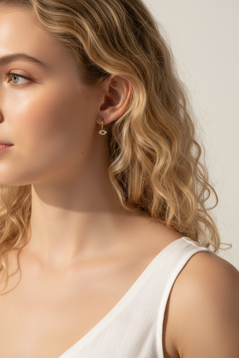 evil eye hoop earrings, gold evil eye charm earrings, 18k gold overlay hoops, pave cubic zirconia earrings, Donna Italiana jewelry, hypoallergenic gold earrings, waterproof gold jewelry, small gold hoop earrings, dainty charm hoops
