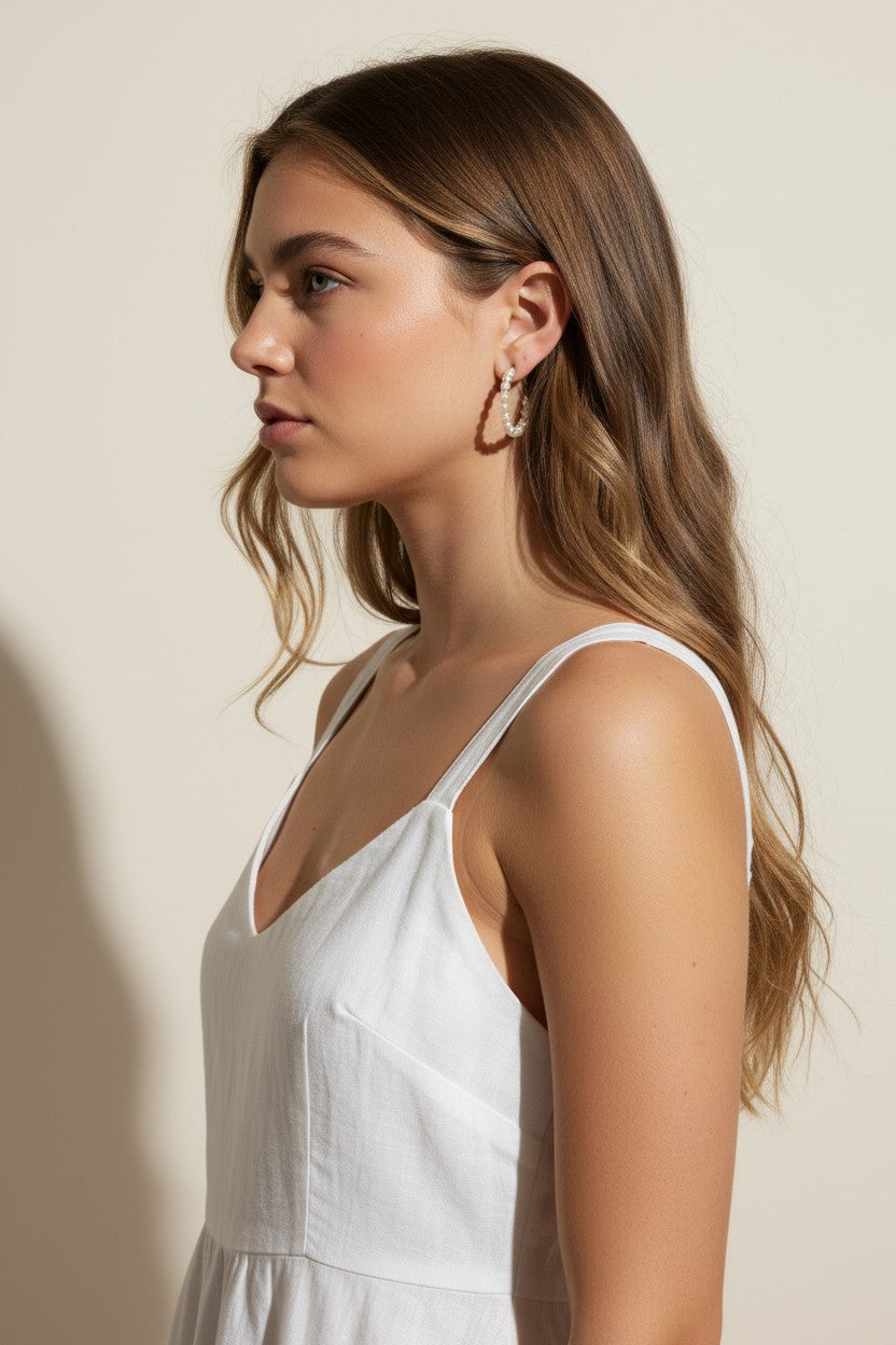 pearl hoop earrings worn, pearl earrings on model multiple hairstyles, classic pearl hoops lifestyle photo, wedding pearl earrings styled, freshwater pearl hoops fit, timeless pearl earrings close-up