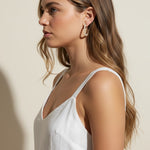 pearl hoop earrings worn, pearl earrings on model multiple hairstyles, classic pearl hoops lifestyle photo, wedding pearl earrings styled, freshwater pearl hoops fit, timeless pearl earrings close-up