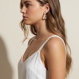 pearl hoop earrings worn, pearl earrings on model multiple hairstyles, classic pearl hoops lifestyle photo, wedding pearl earrings styled, freshwater pearl hoops fit, timeless pearl earrings close-up