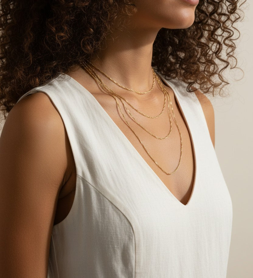 twisted rope chain necklace layered, gold rope chain lifestyle, textured layered necklace, singapore chain necklace, 18k gold twisted chain, cascading gold necklace, stacked rope necklace, gold chain on model