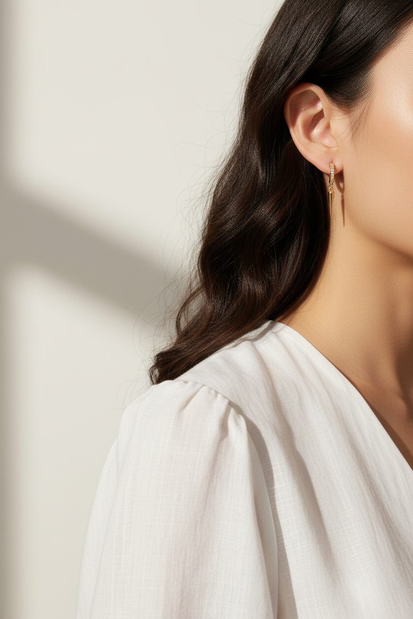 spike drop earrings, pave huggie earrings, gold spike earrings, minimalist drop earrings, huggie hoop with charm, edgy gold earrings, dainty spike jewelry, drop earrings on-model