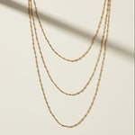 satellite chain necklace detail, beaded chain necklace close up, layered gold necklace texture, delicate gold chain detail, 18k gold satellite chain, dainty beaded necklace, graduated chain flat lay, faceted bead chain necklace
