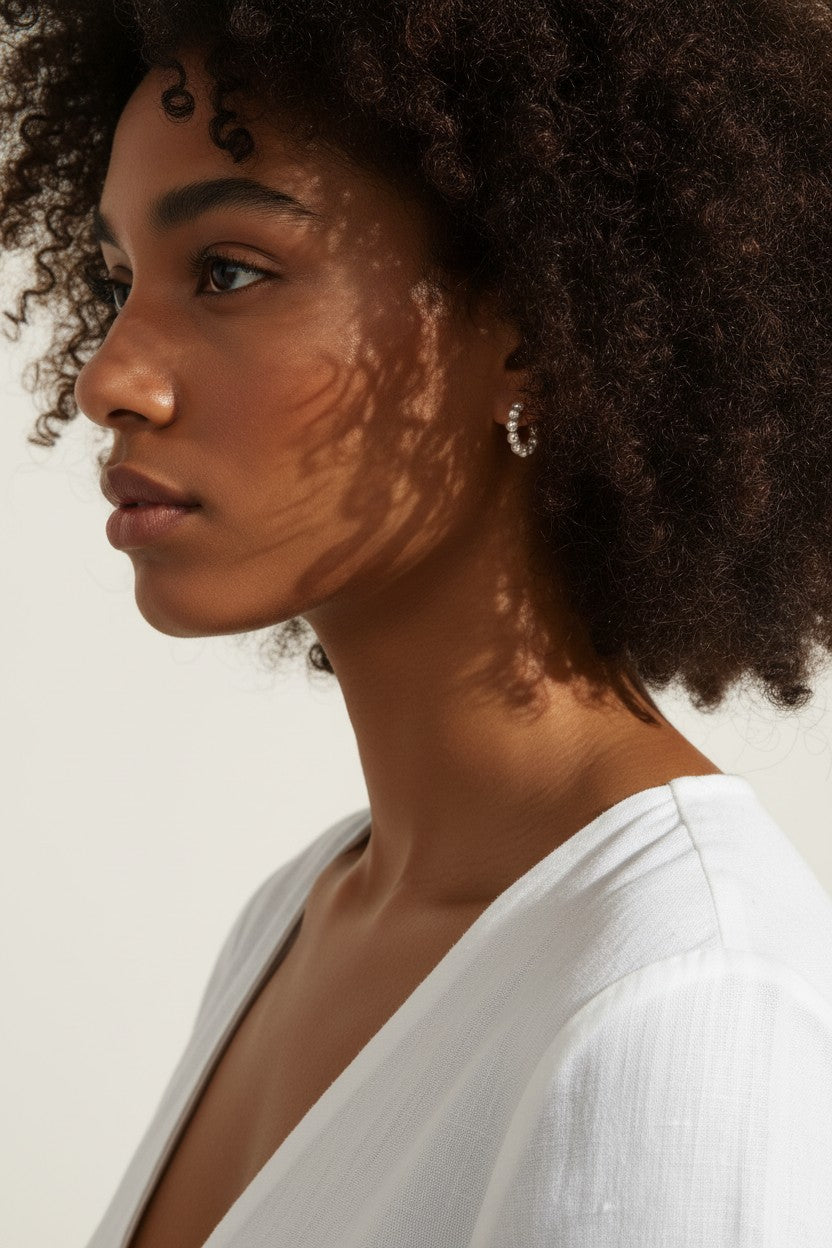 pearl hoop earrings on model, small pearl hoops lifestyle, freshwater pearl earrings, gold and pearl hoop earrings, dainty pearl earrings, pearl huggie earrings, minimalist pearl jewelry, everyday pearl earrings