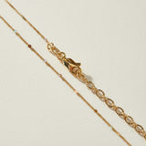 layered station necklace, multicolor bead necklace, gold and enamel chain necklace, cascading layered necklace, dainty station chain, 18k gold layered necklace, colorful bead station necklace, multi strand necklace with clasp