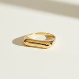 vertical bar ring flat lay, gold bar ring detail, minimalist geometric ring, modern stacking ring, architectural gold ring, sleek bar ring, curved band ring, statement bar ring
