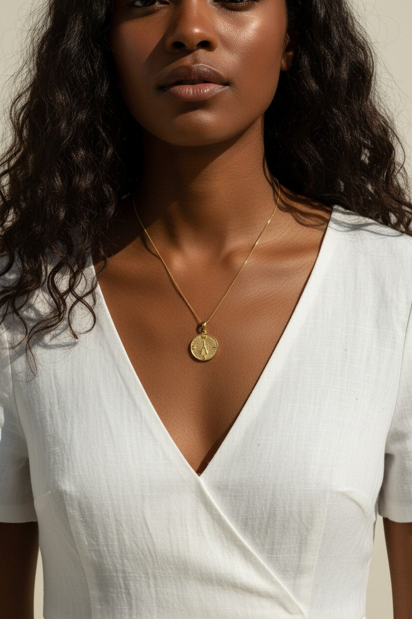 gold wishbone necklace, compass coin pendant necklace, medallion necklace gold, symbolic jewelry, vintage coin necklace, textured gold necklace, lucky charm necklace, layering necklace