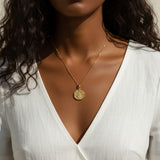 gold wishbone necklace, compass coin pendant necklace, medallion necklace gold, symbolic jewelry, vintage coin necklace, textured gold necklace, lucky charm necklace, layering necklace