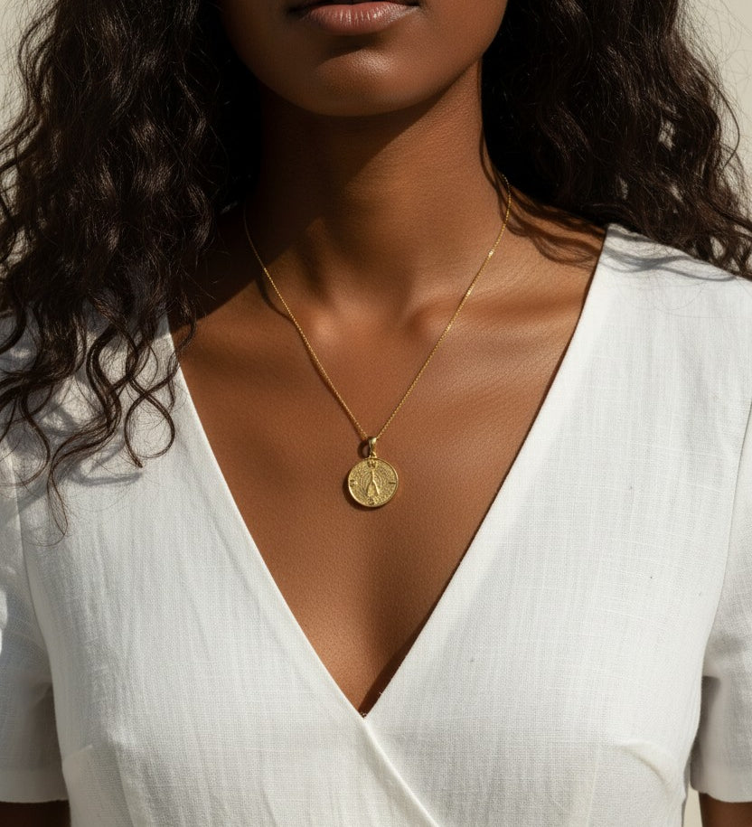 gold wishbone necklace, compass coin pendant necklace, medallion necklace gold, symbolic jewelry, vintage coin necklace, textured gold necklace, lucky charm necklace, layering necklace