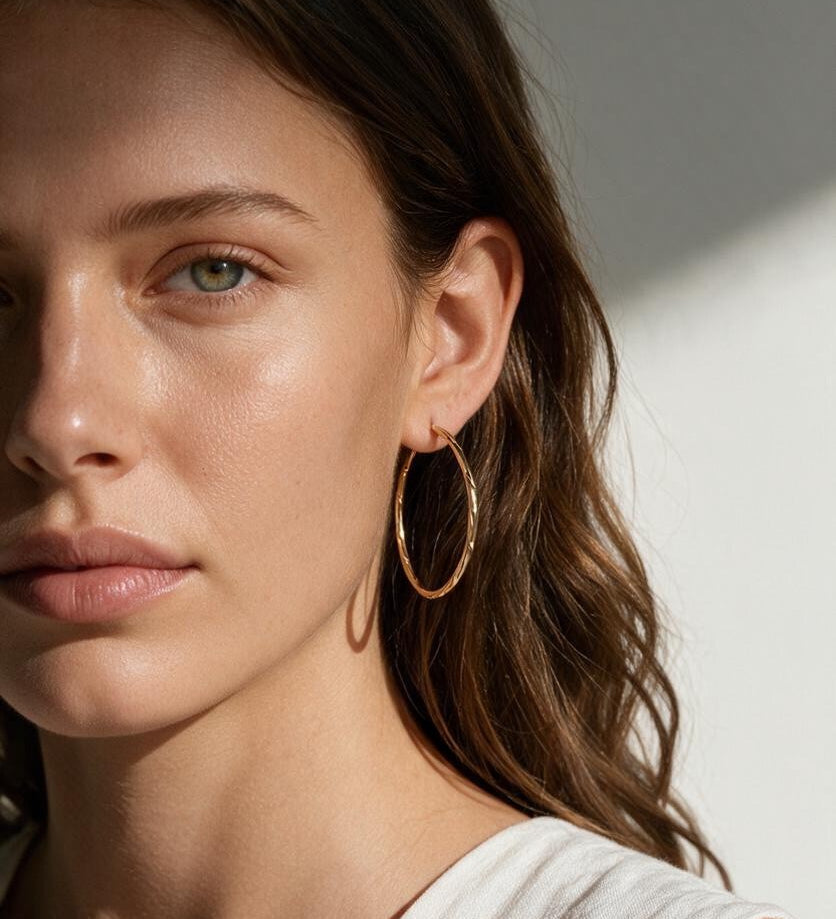 gold hoop earrings on model, textured gold hoops, thin endless hoop earrings, diamond-cut hoop earrings, lightweight hoop earrings, medium gold hoops, minimalist gold hoops, everyday hoop earrings, sleeper hoops, twist hoop earrings, women’s gold hoops, elegant everyday earrings